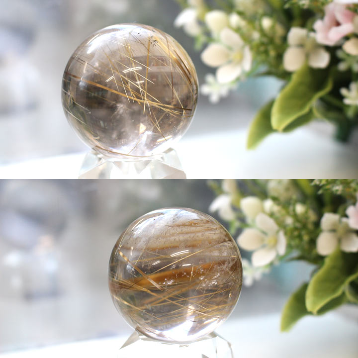 鑑別書付き　スモーキールチルクォーツ 約39mm球 丸玉（天然石 パワーストーン 球体）別角度で花の前に置いて撮影